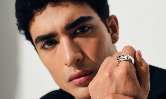 man wearing Tom wood crest ring