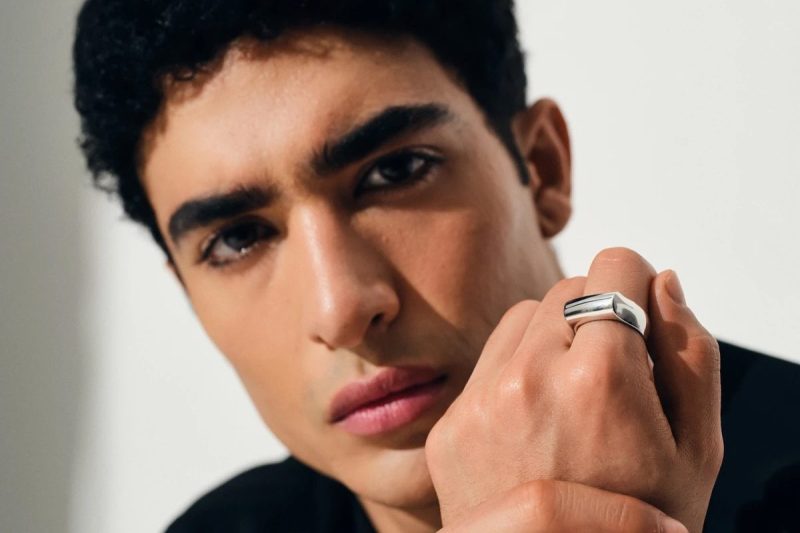 man wearing Tom wood crest ring